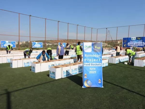 Volunteers distributing baskets in local neighborhoods